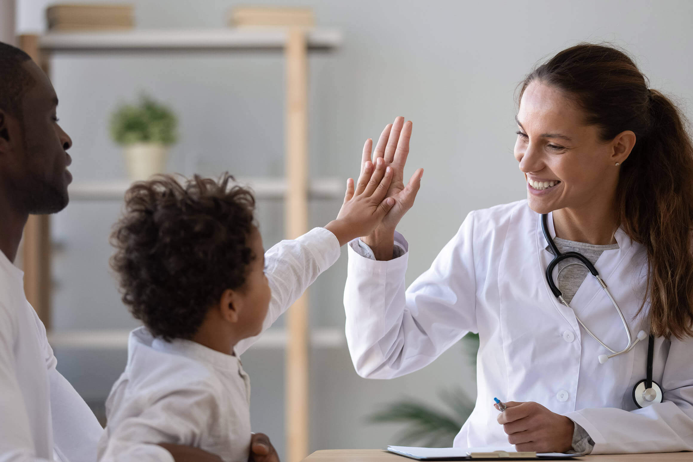 The James Clinic doctor giving patient child high five